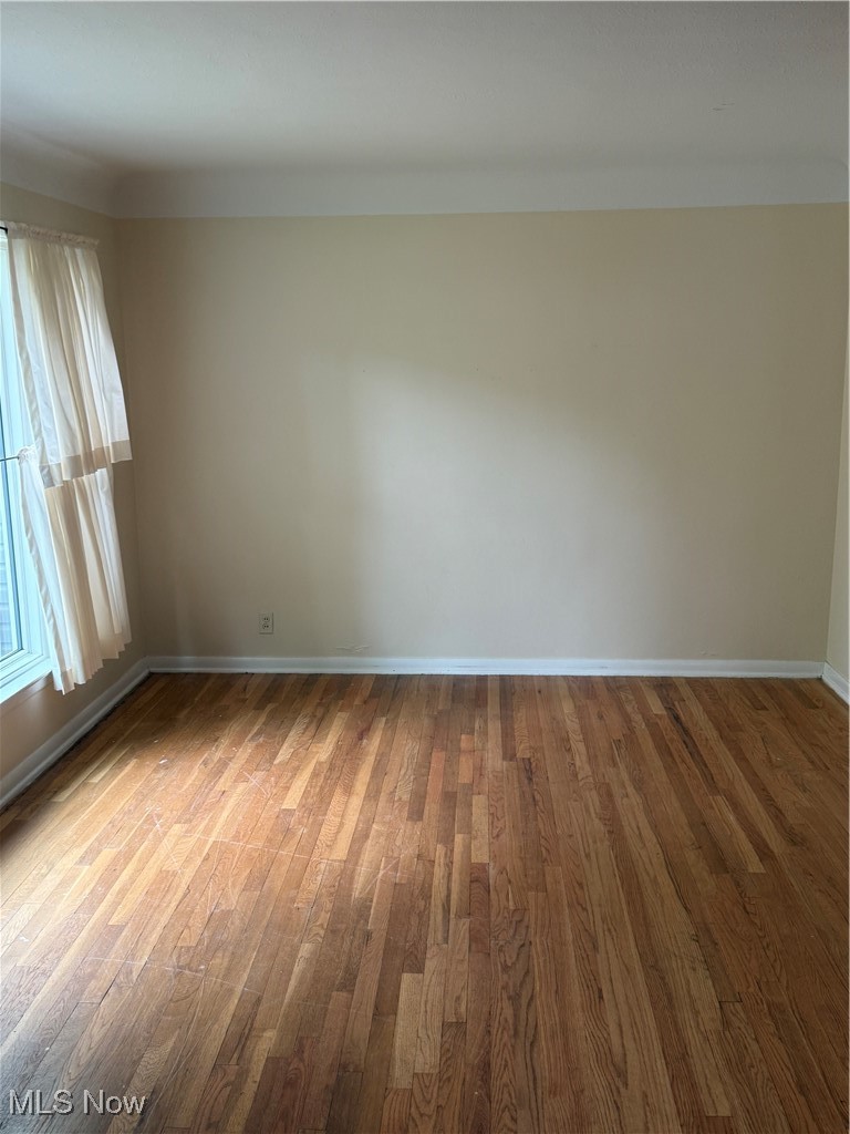 1284 Haverston Road Lyndhurst, OH 44124 - Photo 10 of 43 Spare room featuring wood finished floors and baseboards