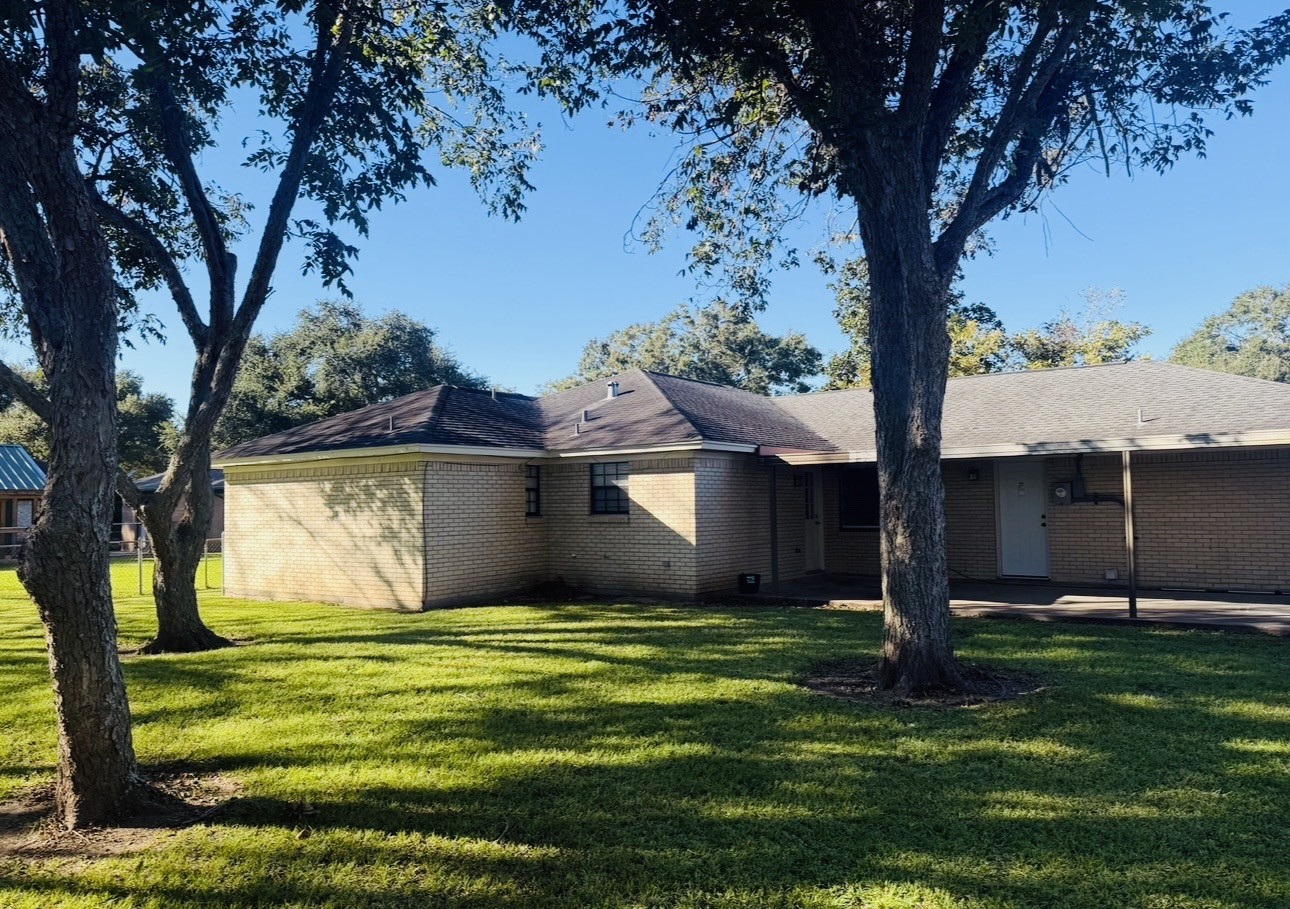 1457 Camellia Street Sweeny, TX 77480 - Photo 24 of 26 a view of a back yard of the house