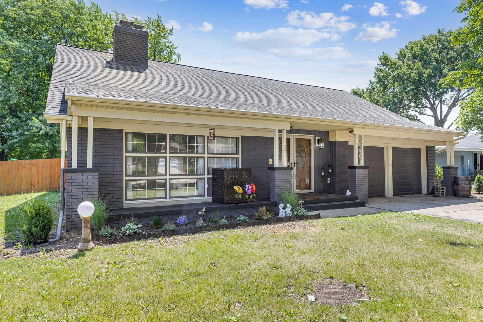 1229 Crest Lane Rochelle, IL 61068 - Photo 1 of 30 front view of a house with a yard