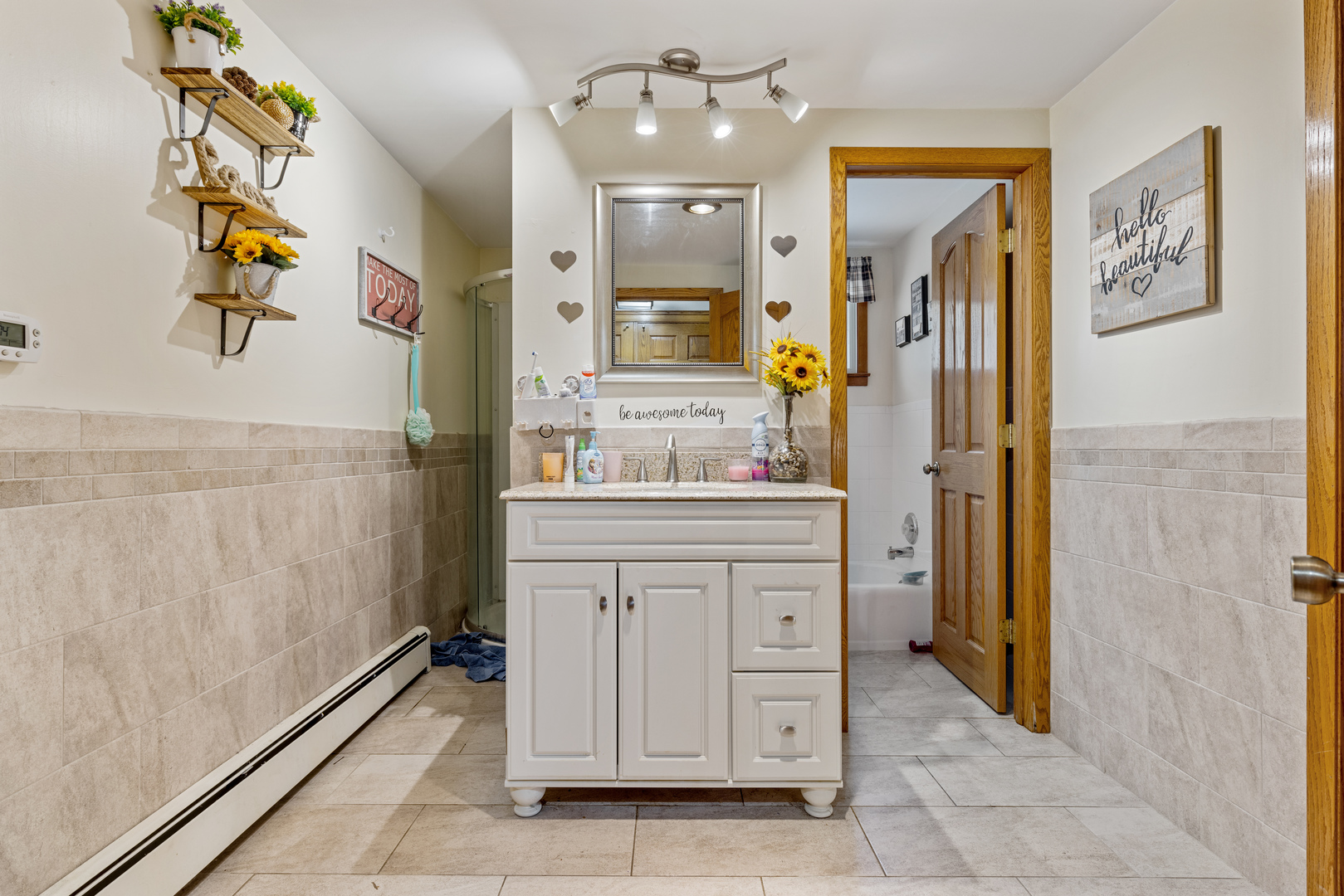 1229 Crest Lane Rochelle, IL 61068 - Photo 15 of 30 a bathroom with a sink a vanity and a mirror