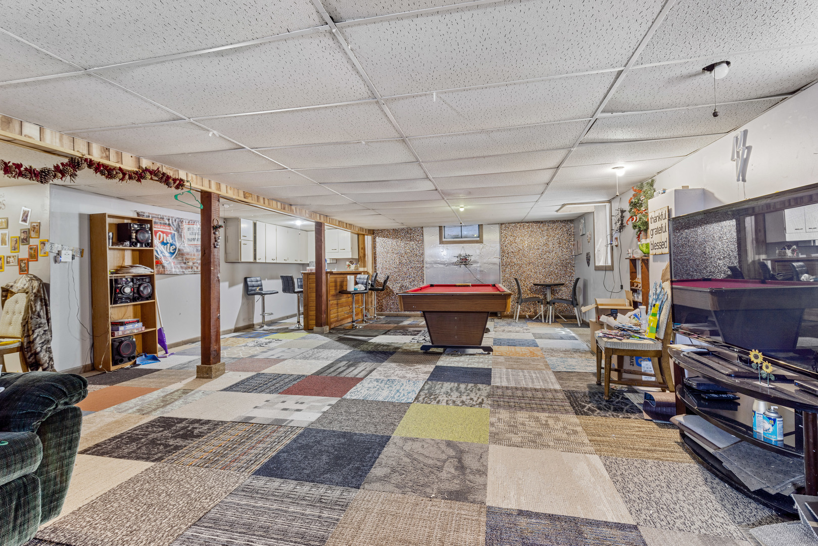 1229 Crest Lane Rochelle, IL 61068 - Photo 22 of 30 a living room with lots of furniture and a rug