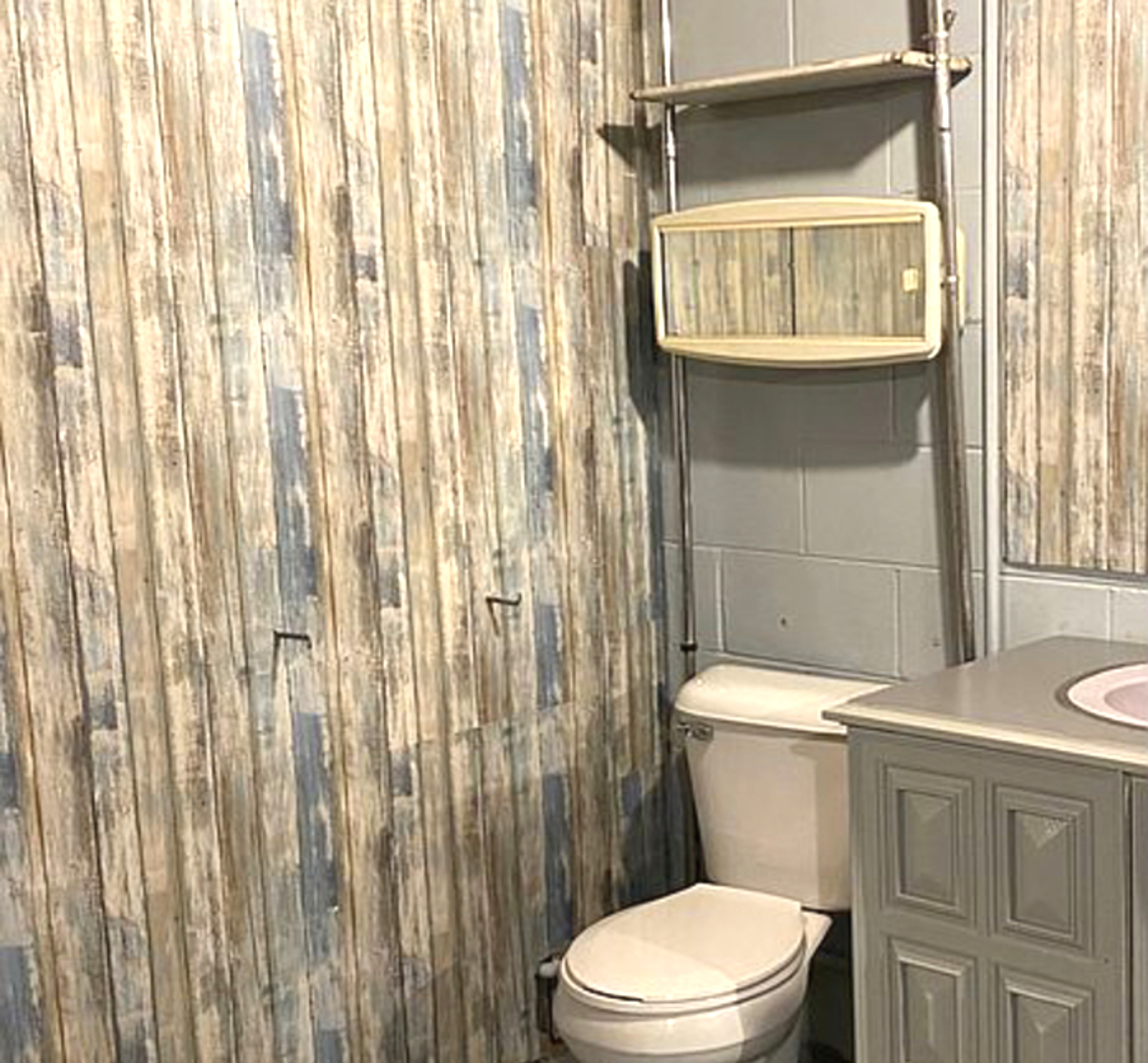 1229 Crest Lane Rochelle, IL 61068 - Photo 24 of 30 a bathroom with a toilet and a shower curtain