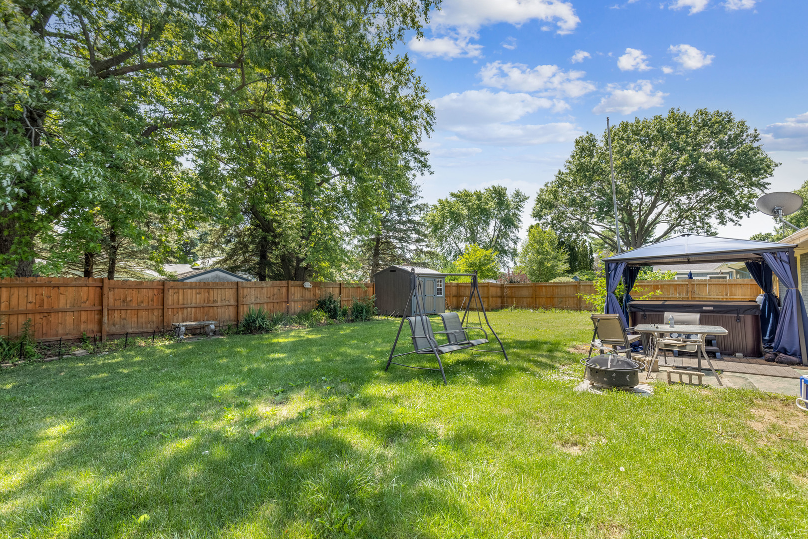 1229 Crest Lane Rochelle, IL 61068 - Photo 27 of 30 a view of a backyard with a garden and entertaining space