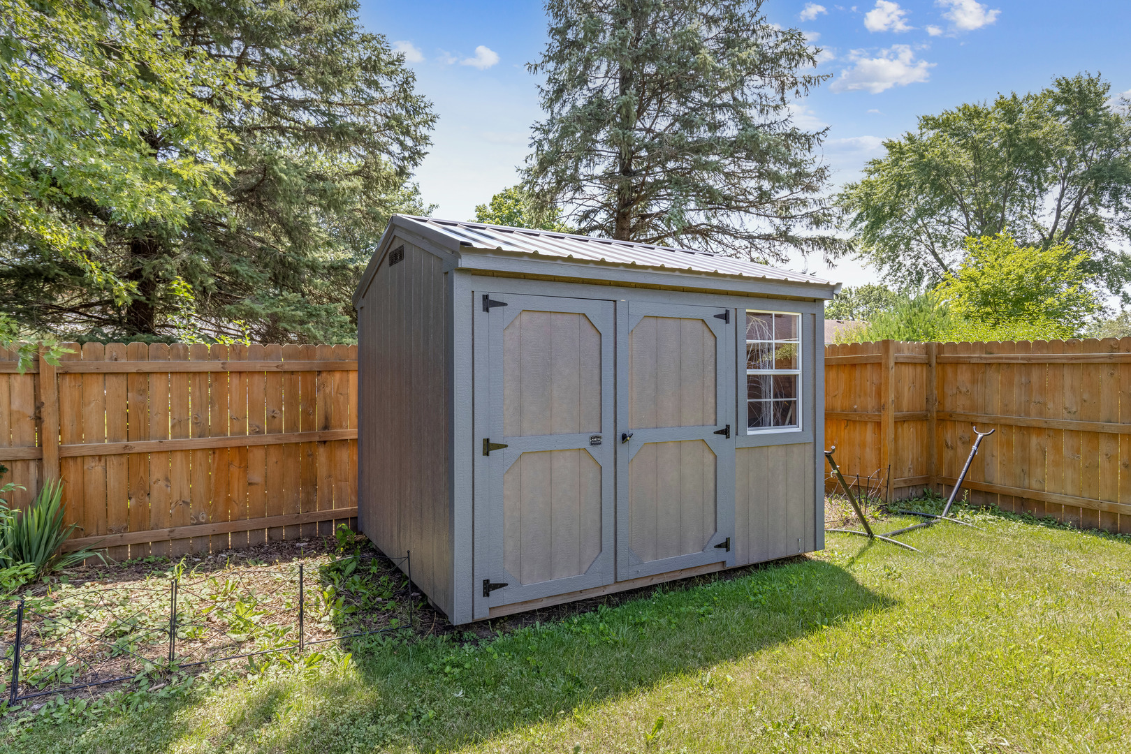 1229 Crest Lane Rochelle, IL 61068 - Photo 29 of 30 a view of backyard with small cabin and wooden fence