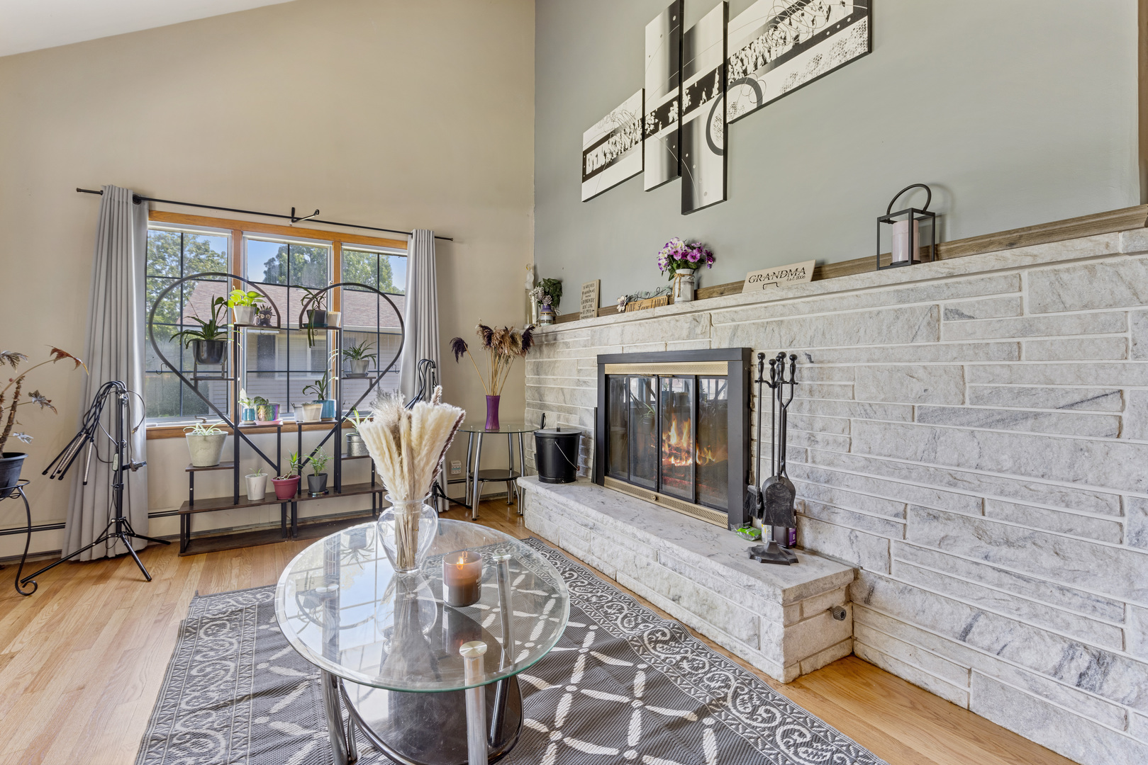 1229 Crest Lane Rochelle, IL 61068 - Photo 3 of 30 a living room with furniture a fireplace and a table