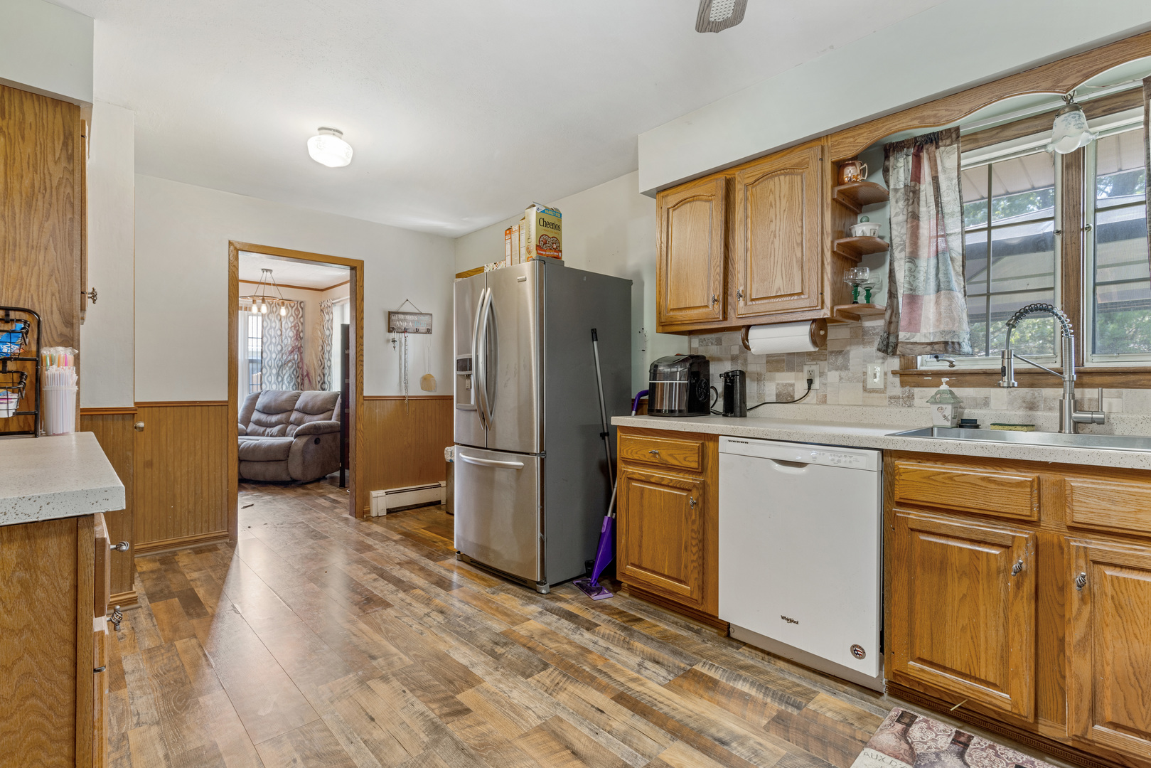 1229 Crest Lane Rochelle, IL 61068 - Photo 7 of 30 a kitchen with refrigerator cabinets and wooden floor