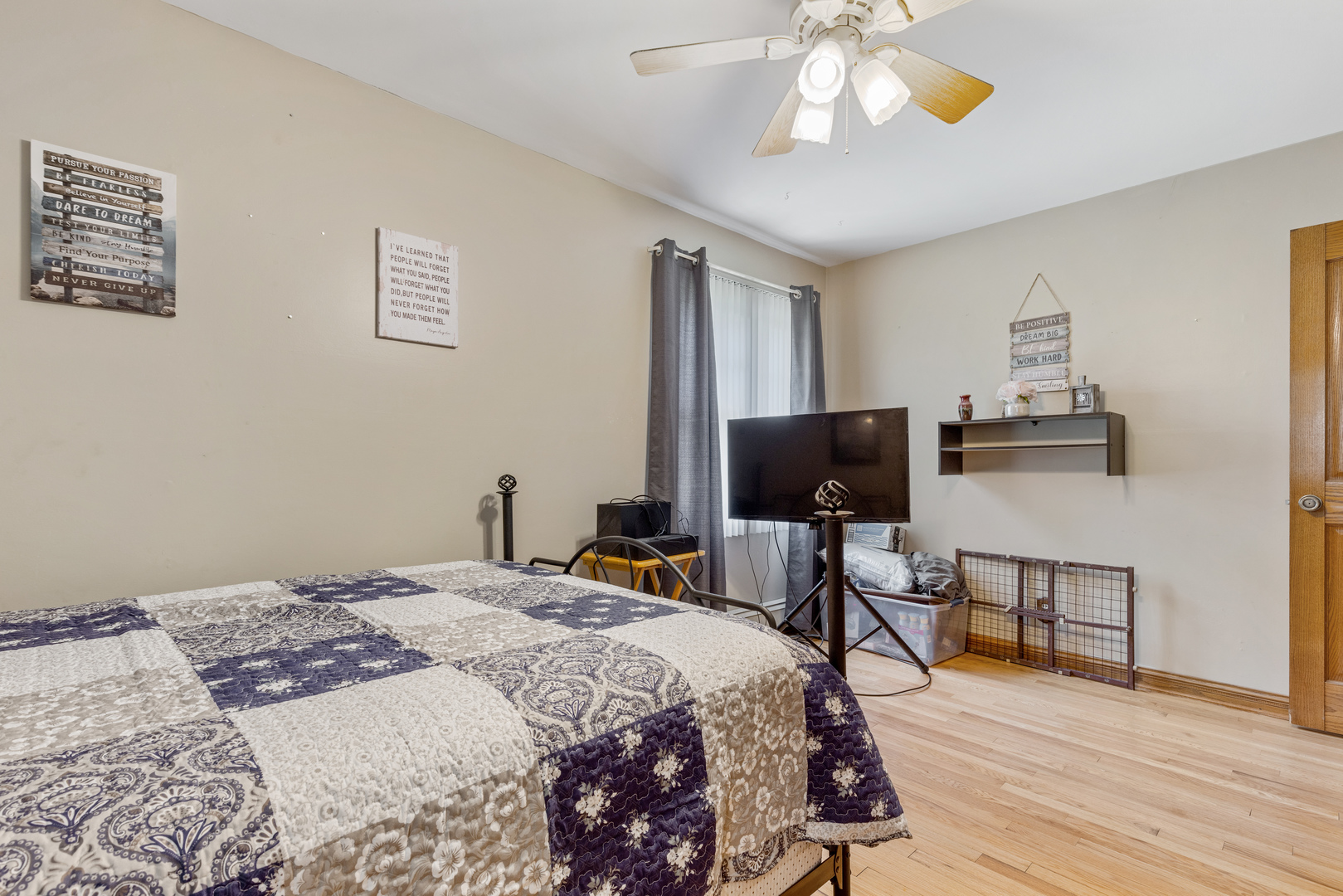 1229 Crest Lane Rochelle, IL 61068 - Photo 10 of 30 a bedroom with a bed and a flat screen tv