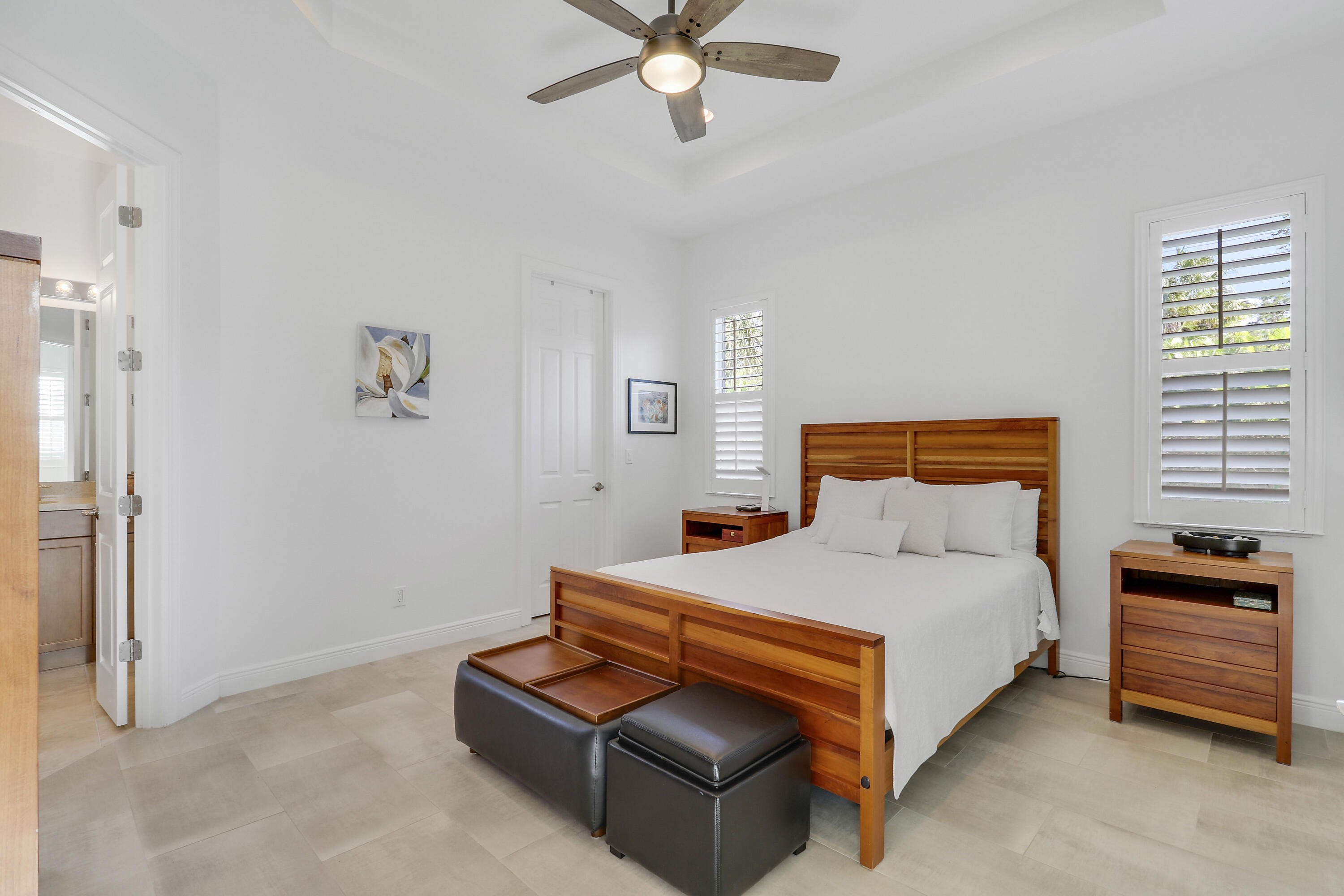 11215 Southwest Visconti Way Port St. Lucie, FL 34986 - Photo 18 of 61 a bedroom with a bed and a chandelier