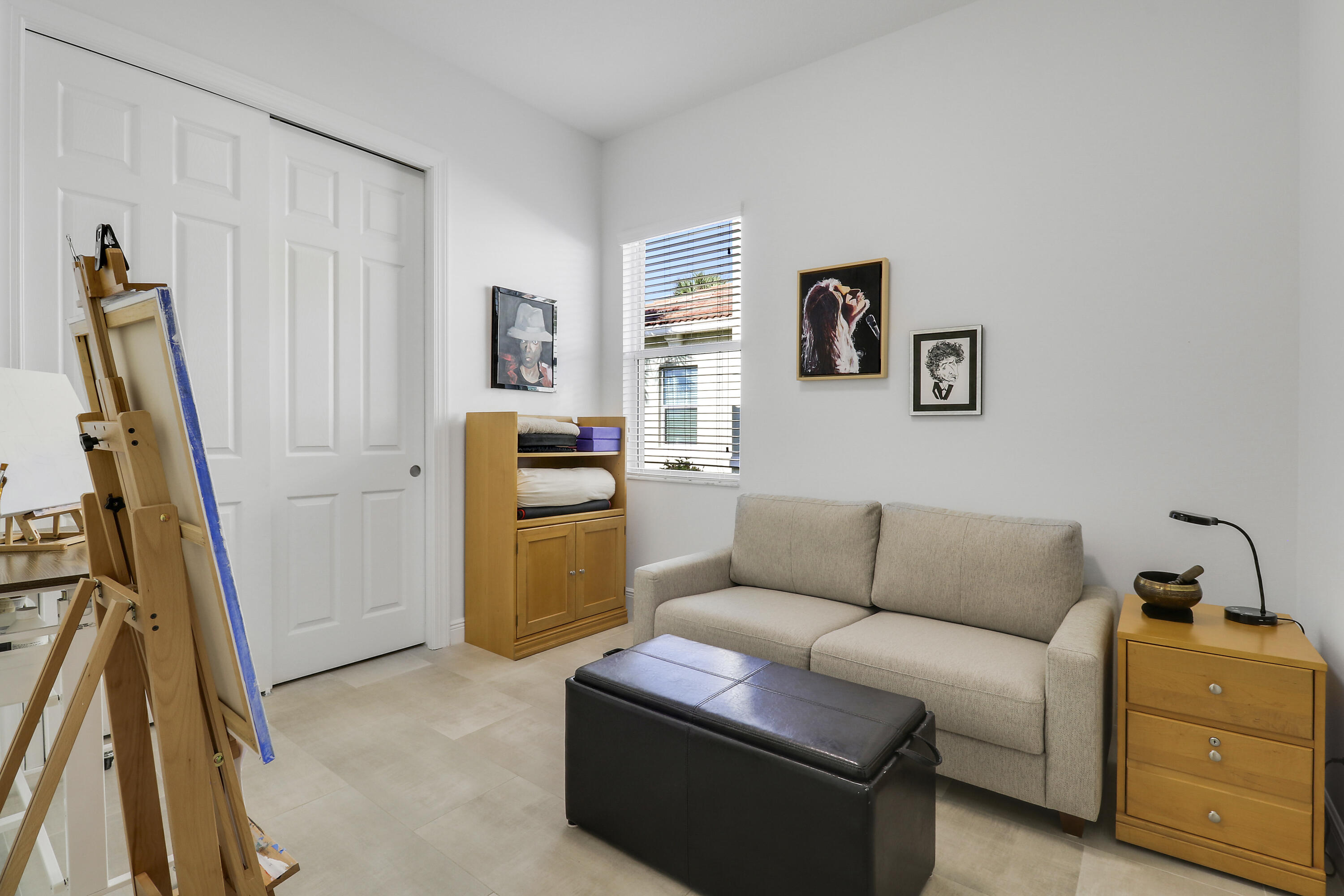 11215 Southwest Visconti Way Port St. Lucie, FL 34986 - Photo 20 of 61 a living room with furniture and a flat screen tv