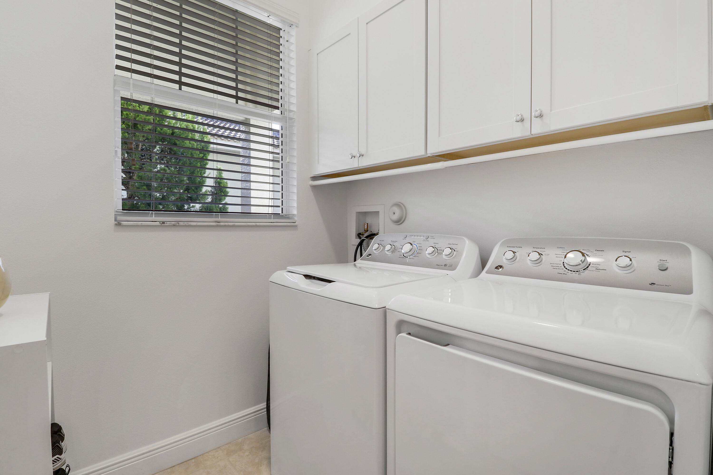 11215 Southwest Visconti Way Port St. Lucie, FL 34986 - Photo 23 of 61 a utility room with dryer and washer