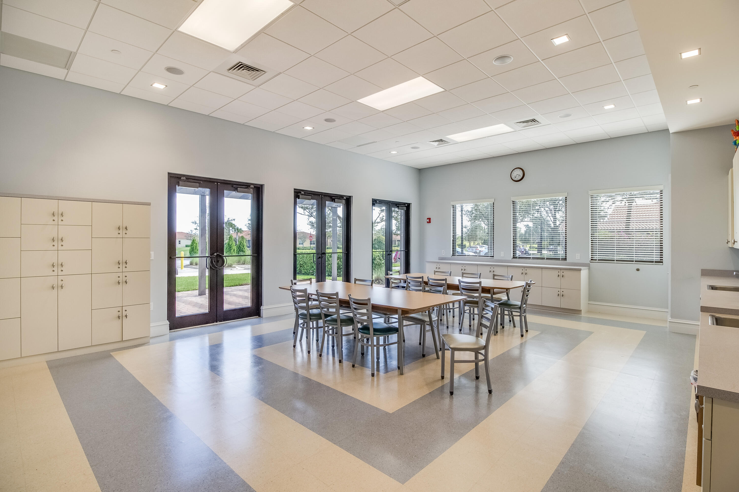 11215 Southwest Visconti Way Port St. Lucie, FL 34986 - Photo 50 of 61 a view of a dining room with furniture wooden floor and chandelier