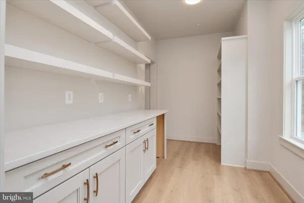 a view of kitchen with wooden floor