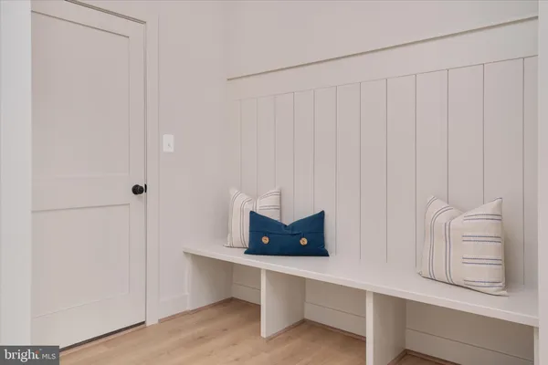 a room with white wall and closet
