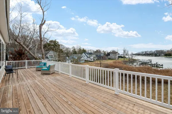 a view of a balcony with wooden floor