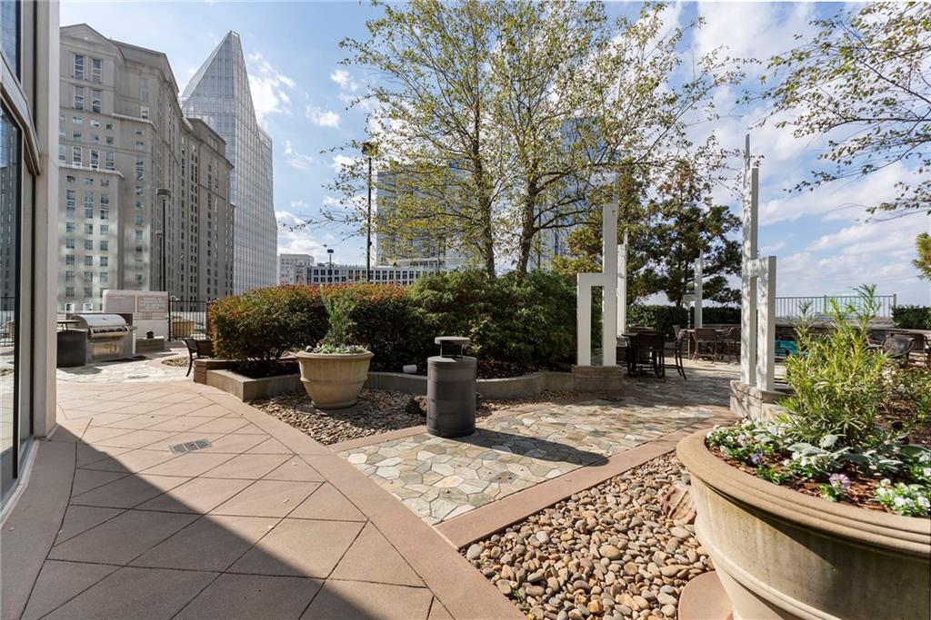3324 Peachtree Road Northeast, Unit 2804 Atlanta, GA 30326 - Photo 17 of 32 a view of a terrace with chairs and potted plants