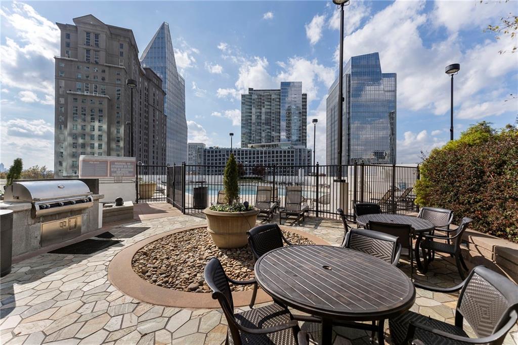 3324 Peachtree Road Northeast, Unit 2804 Atlanta, GA 30326 - Photo 19 of 34 a view of a roof deck with couches and chairs