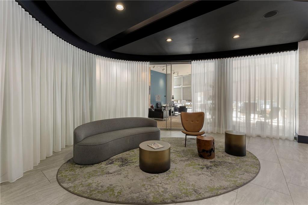 3324 Peachtree Road Northeast, Unit 2804 Atlanta, GA 30326 - Photo 19 of 32 a living room with furniture and a potted plant