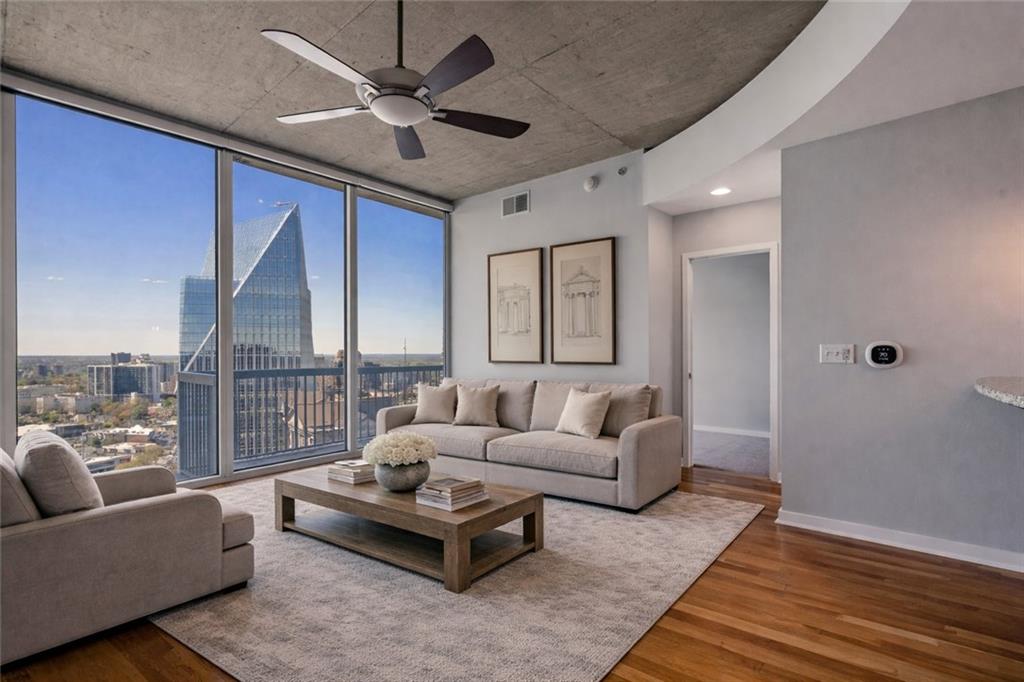3324 Peachtree Road Northeast, Unit 2804 Atlanta, GA 30326 - Photo 2 of 34 a living room with furniture and a large window
