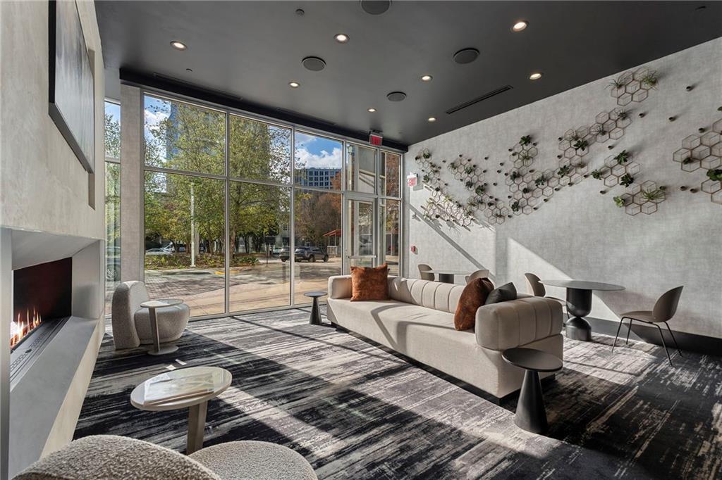 3324 Peachtree Road Northeast, Unit 2804 Atlanta, GA 30326 - Photo 23 of 32 a living room with furniture and a fireplace