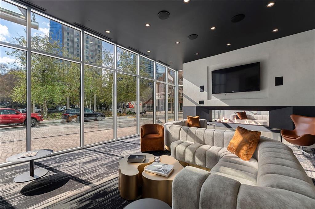 3324 Peachtree Road Northeast, Unit 2804 Atlanta, GA 30326 - Photo 24 of 32 a living room with furniture and a flat screen tv