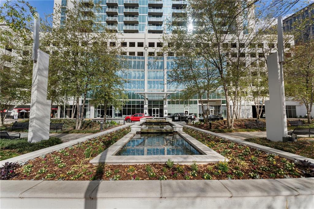 3324 Peachtree Road Northeast, Unit 2804 Atlanta, GA 30326 - Photo 25 of 32 a front view of a residential apartment building with a yard
