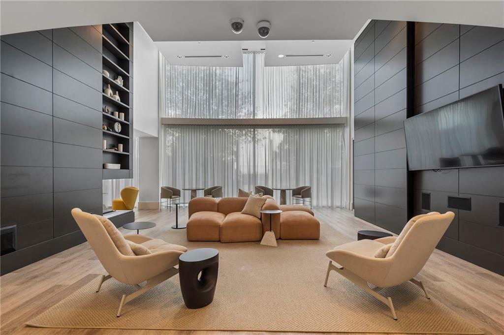 3324 Peachtree Road Northeast, Unit 2804 Atlanta, GA 30326 - Photo 27 of 32 a work room with furniture and a potted plant