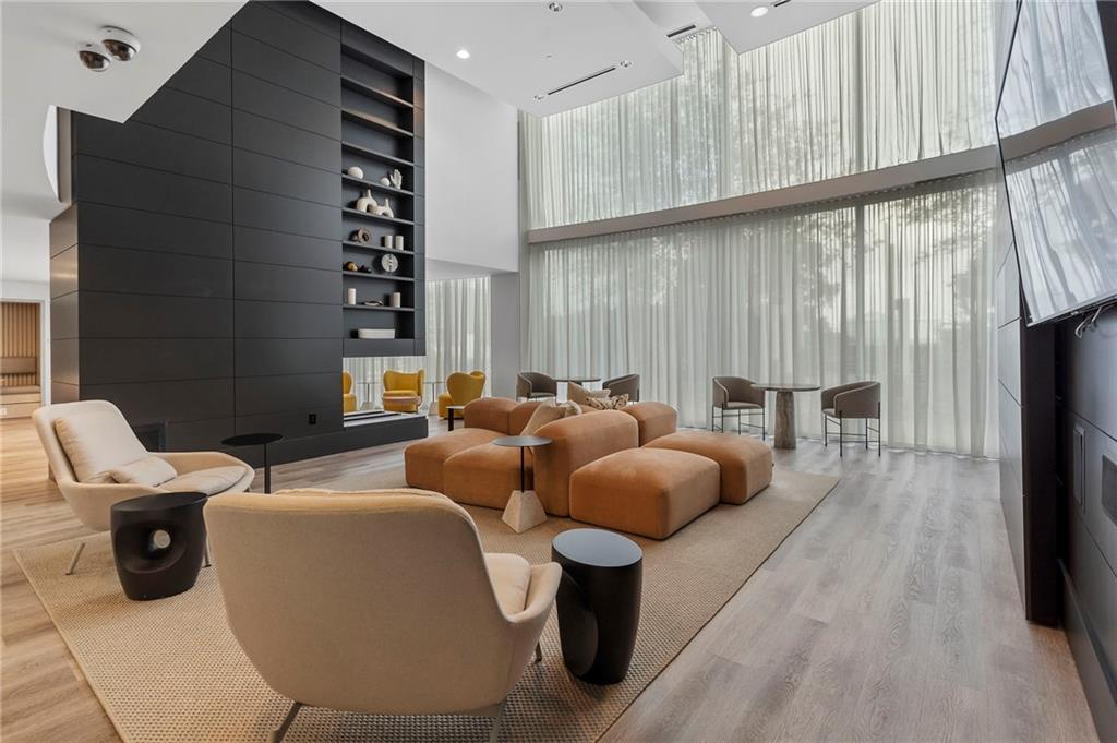 3324 Peachtree Road Northeast, Unit 2804 Atlanta, GA 30326 - Photo 28 of 32 a living room with furniture a rug and a window