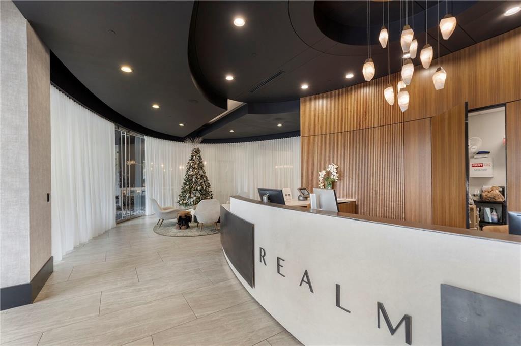 3324 Peachtree Road Northeast, Unit 2804 Atlanta, GA 30326 - Photo 30 of 32 a very nice looking room with a large window and chandelier