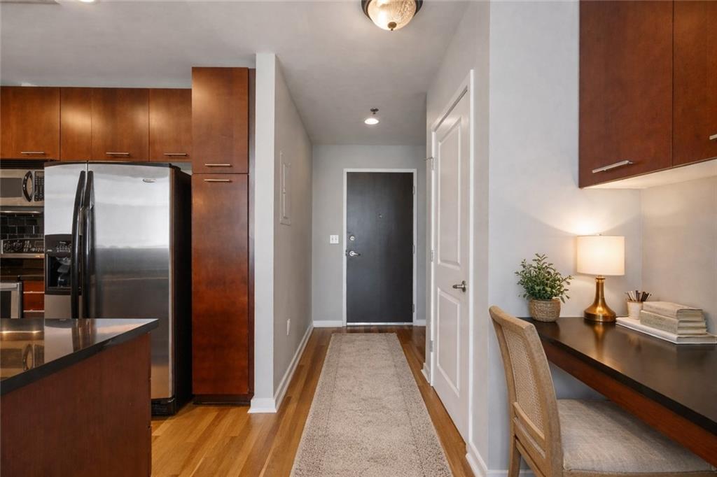 3324 Peachtree Road Northeast, Unit 2804 Atlanta, GA 30326 - Photo 4 of 32 a view of a kitchen from a hallway