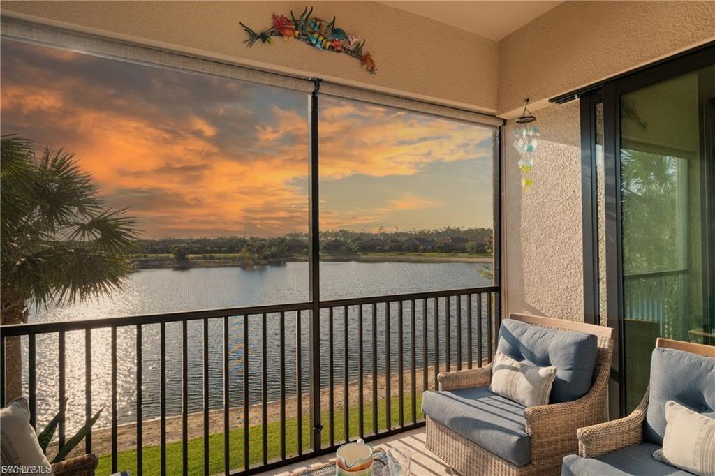 9642 Montelanico Loop, Unit 201 Naples, FL 34119 - Photo 1 of 27 a balcony with view of outdoor space