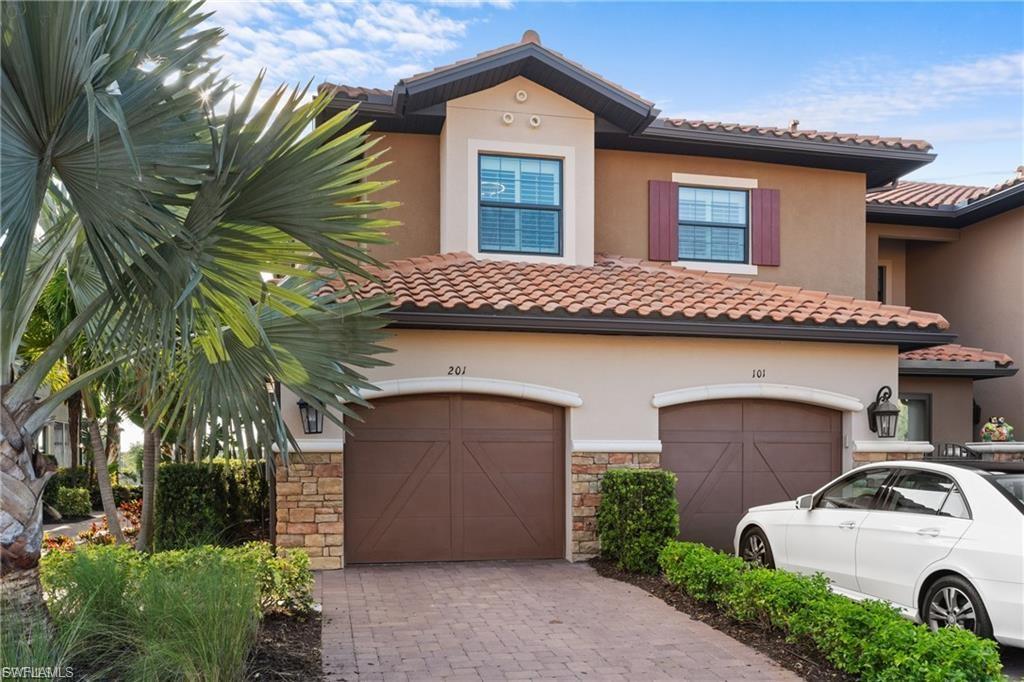 9642 Montelanico Loop, Unit 201 Naples, FL 34119 - Photo 11 of 27 a house with a outdoor space