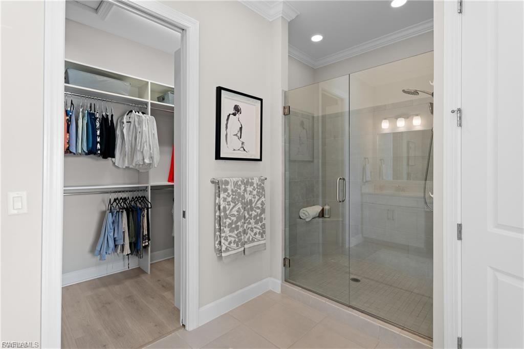 9642 Montelanico Loop, Unit 201 Naples, FL 34119 - Photo 17 of 27 a bathroom with a shower
