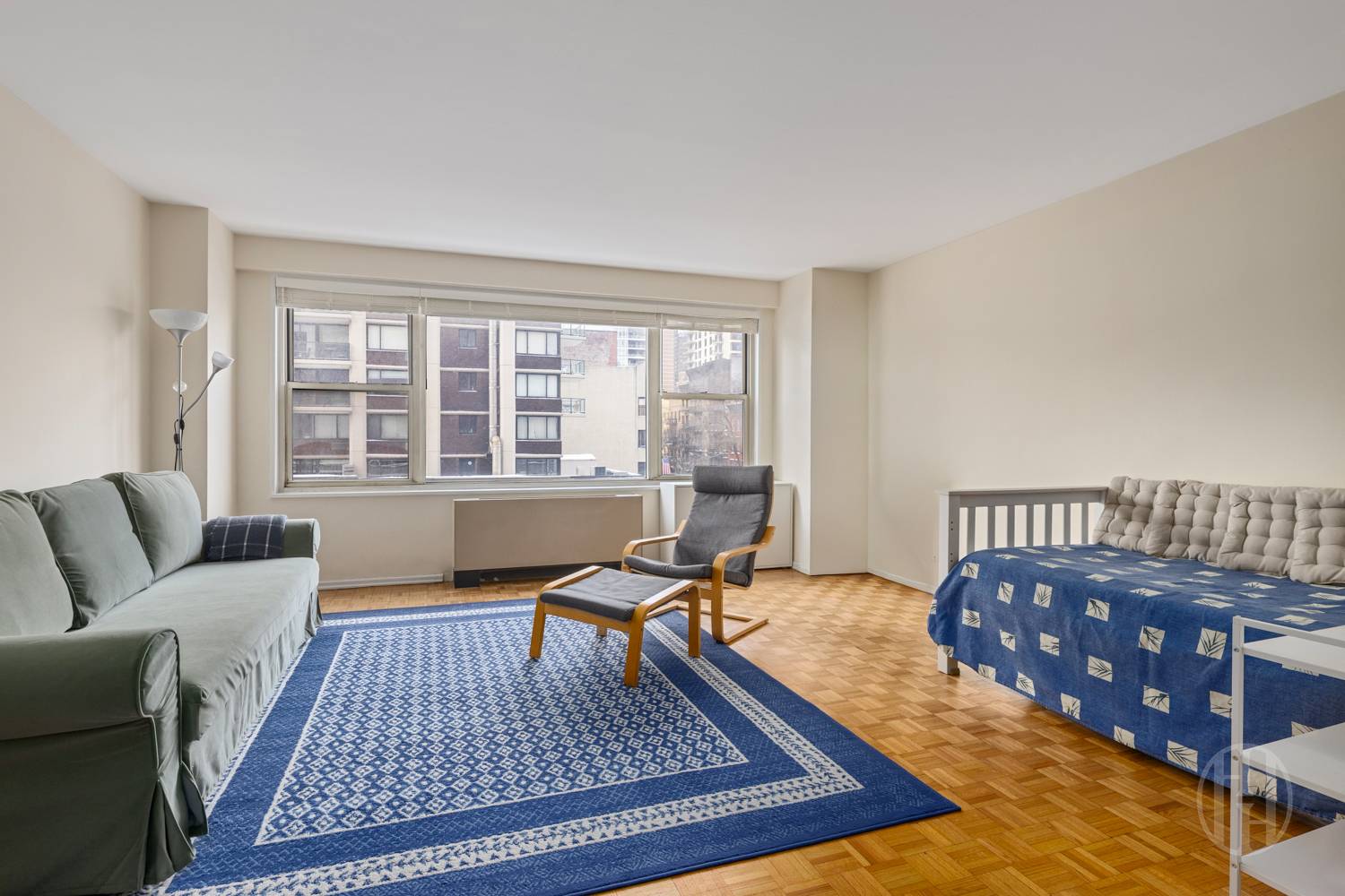 400 East 85th Street, Unit 4G Manhattan, NY 10028 - Photo 1 of 7 a living room with furniture rug and window
