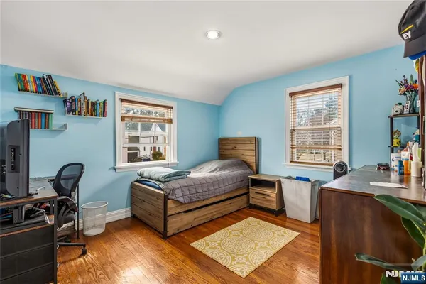 a bedroom with furniture and a window