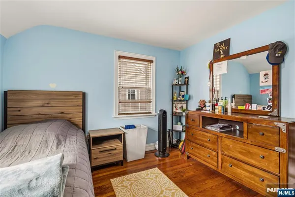 a room with furniture and a mirror