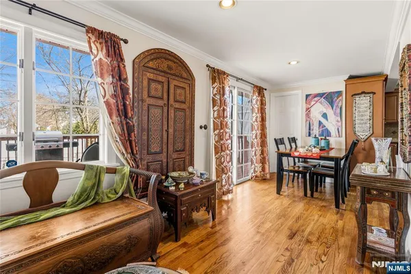 a living room with furniture and floor to ceiling windows