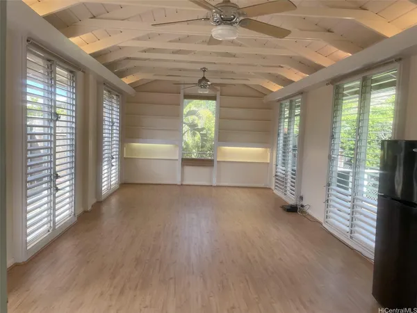 a view of an empty room and a window