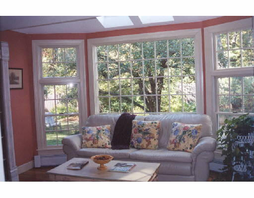 383 Lowell Road Concord, MA 01742 - Photo 3 of 4 a living room with furniture and a large window