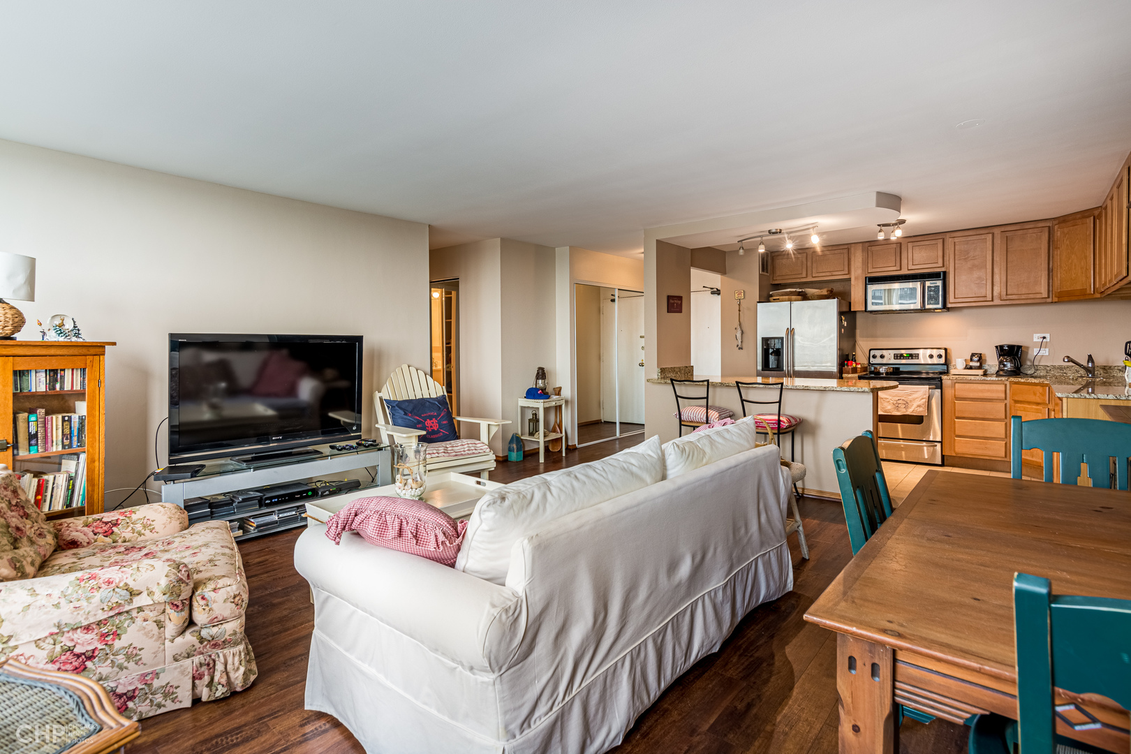 5455 North Sheridan Road, Unit 710 Chicago, IL 60640 - Photo 6 of 11 a living room with furniture and a flat screen tv
