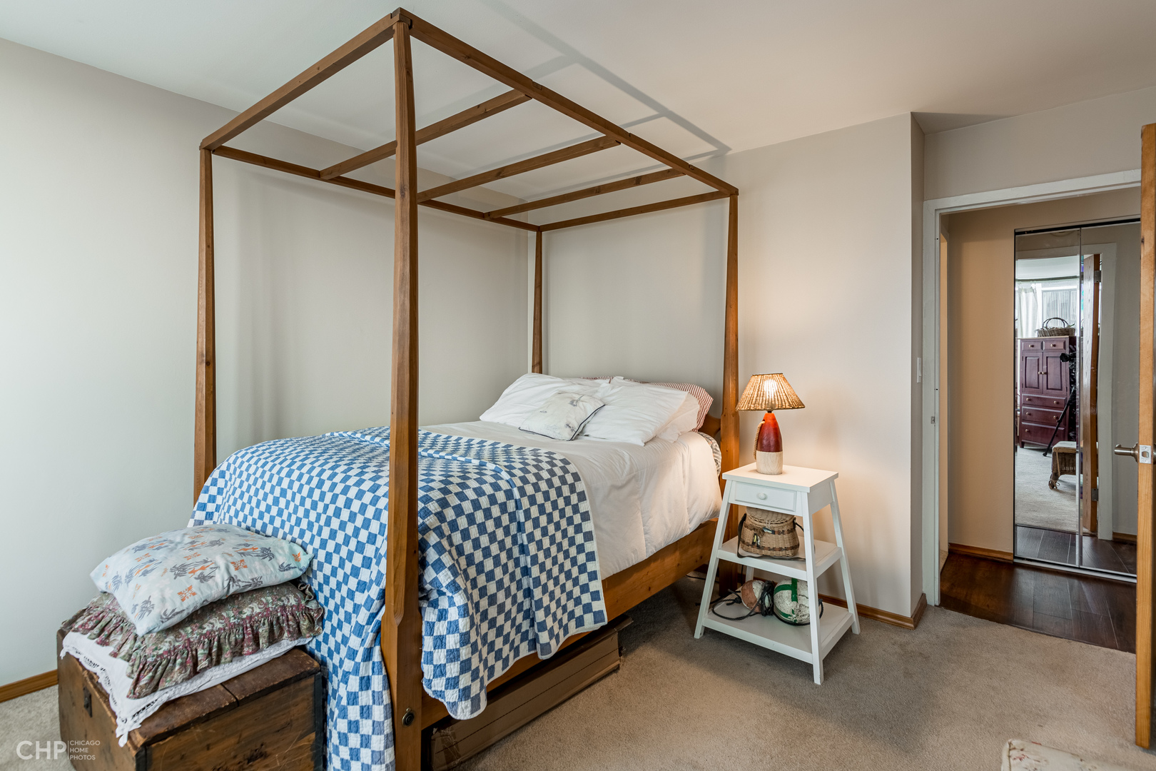 5455 North Sheridan Road, Unit 710 Chicago, IL 60640 - Photo 8 of 11 a bedroom with a bed and a chair