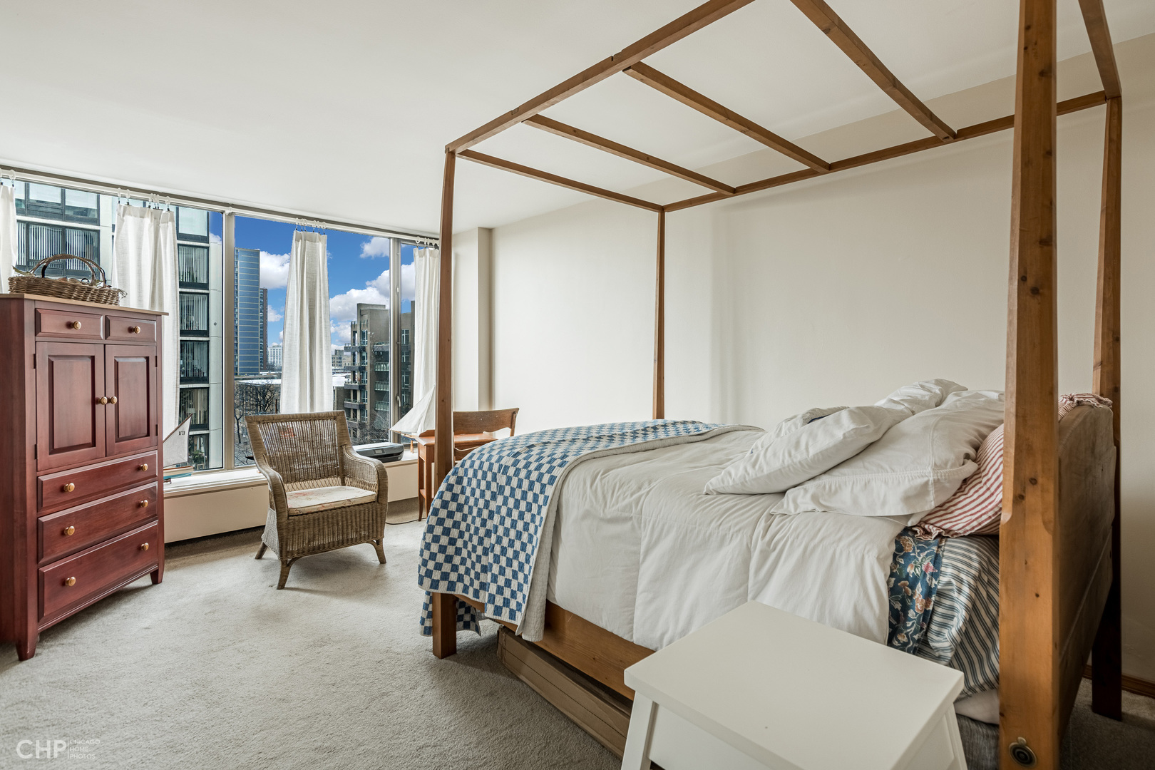 5455 North Sheridan Road, Unit 710 Chicago, IL 60640 - Photo 9 of 11 a bedroom with furniture and a window