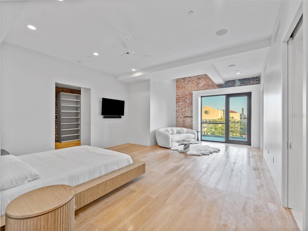 465 Central Avenue, Unit 301 St. Petersburg, FL 33701 - Photo 11 of 47 a bedroom with a bed and a flat screen tv