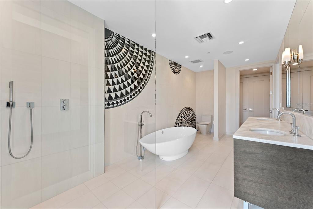 465 Central Avenue, Unit 301 St. Petersburg, FL 33701 - Photo 16 of 47 a bathroom with a sink a toilet and shower