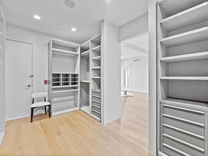 a view of wooden floor and windows in a room