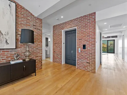 a spacious bathroom with a granite countertop sink and a mirror