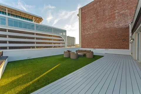 a view of a backyard with sitting area