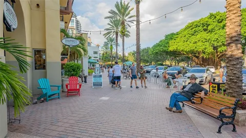 a view of a ocean with boats next to both of building