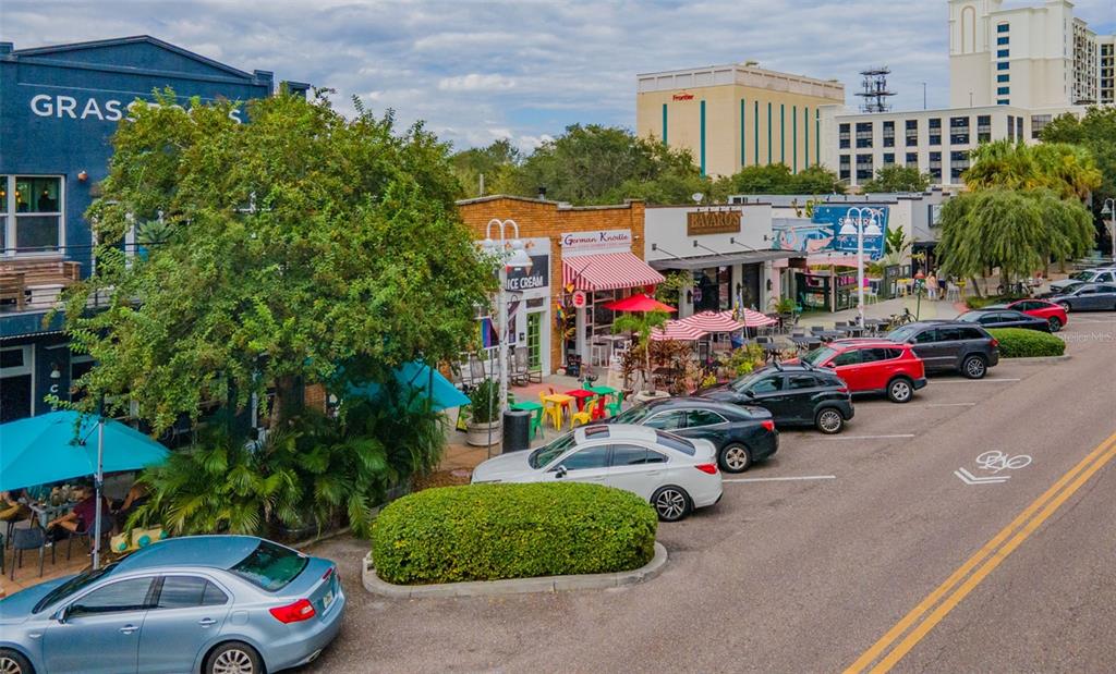 465 Central Avenue, Unit 301 St. Petersburg, FL 33701 - Photo 42 of 47 a view of cars parked in front of a building