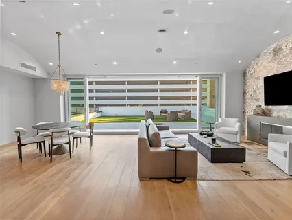 a living room with fireplace furniture and a flat screen tv