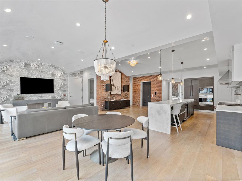 465 Central Avenue, Unit 301 St. Petersburg, FL 33701 - Photo 8 of 47 a large kitchen with a table and chairs